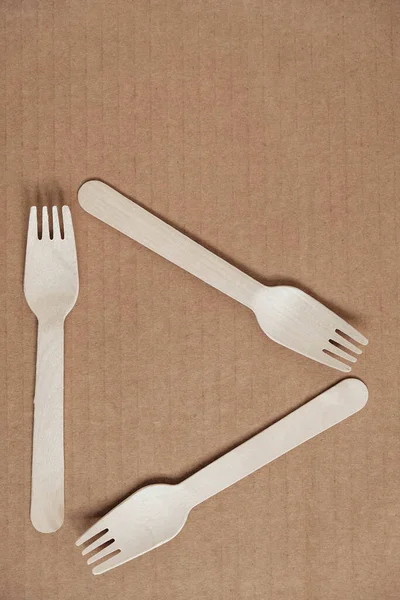 Wooden Forks Cardboard Background Eco Friendly Disposable Tableware Top View — Stock Photo, Image