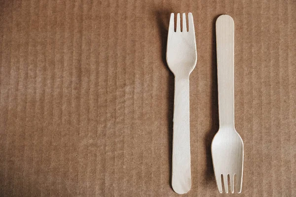 Wooden Forks Cardboard Background Eco Friendly Disposable Tableware Top View — Stock Photo, Image