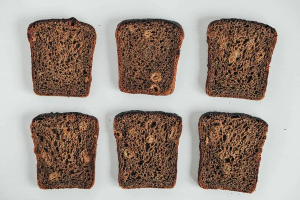 Slices Fresh Brown Bread Raisins White Wooden Background Top View — Stock Photo, Image