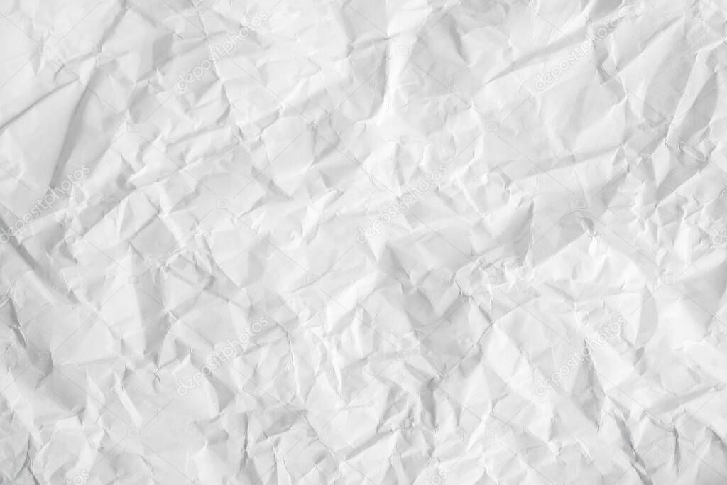 Crumpled white paper texture as a background image. Paper for design with copy space for text or image. Top view. Copy, empty space for text.