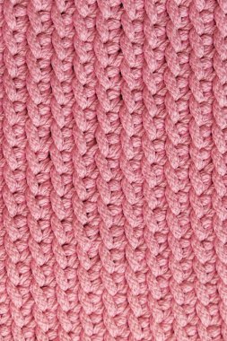 Pembe örülmüş malzeme dokusu arka planı. Üst Manzara. Kopyala, metin için boşluk.