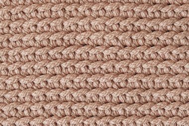 Açık kahverengi örülmüş kumaş dokusu arka planı. Üst Manzara. Kopyala, metin için boşluk.