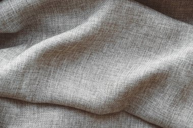 Arka plan dokusu olarak buruşmuş gri keten kumaş. Üst Manzara. Kopyala, metin için boşluk.