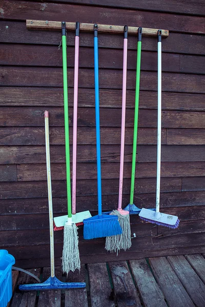 Cleaning equipment on wooden wall