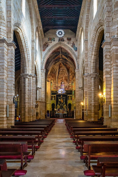 Cordoba, Spain - November 02, 2019: San Lorenzo church in Cordoba, Andalusia, Spain. It was built between around 1244 and 1300 in a transitional style between Romanesque and Gothic architecture.