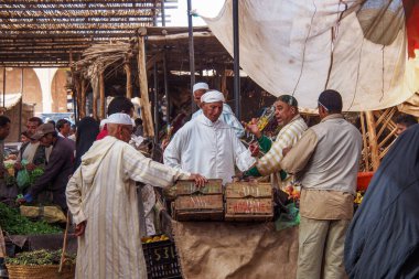 Rissani, Morocco - Oct 18, 2019: Rissani market is considered as the most important market in the region, both in terms of character, architecture and strategic location clipart