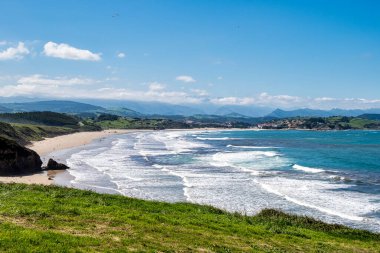 Beautiful landscape with beach in San Vincente de la Barquera in Spain. North coast of Spain. Bay of Biscay. clipart