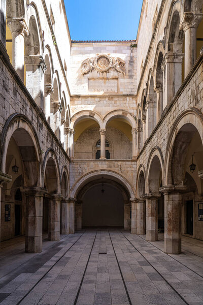 Stone arches decorate the Sponza palace inside the old town of Dubrovnik in Croatia