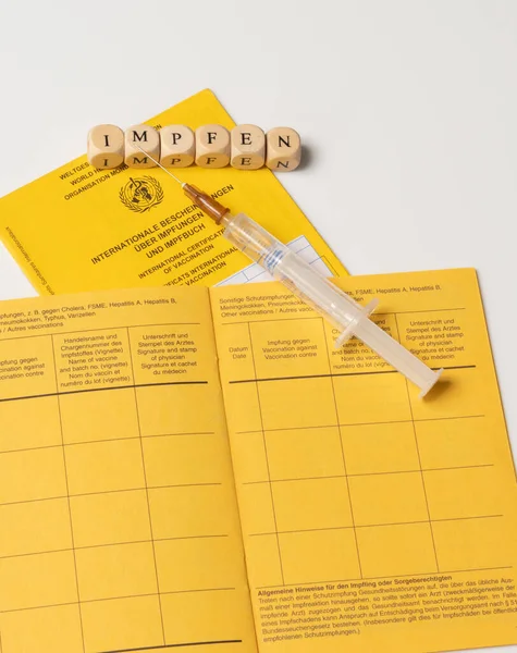Word Vaccination Disposable Syringe German Vaccination Book — Stock Photo, Image