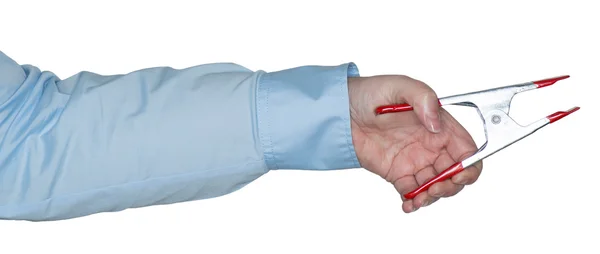 Female arm holding a staple in the hand — Stock Photo, Image