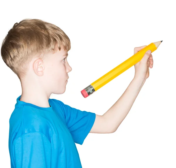 Kind met een potlood in de hand — Stockfoto