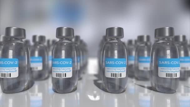 4k video of covid-19 vaccine bottles. — Stock Video