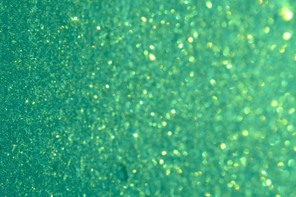 Fondo verde brillante lentejuelas redondas borrosas Desenfocado —  Fotos de Stock