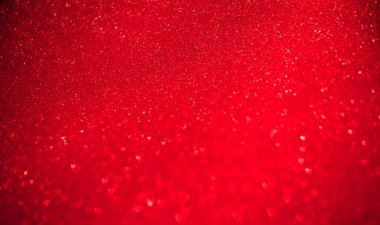 Bulanık kalplerin kırmızı arkaplanı, dağılmış kalplerin kenarı..