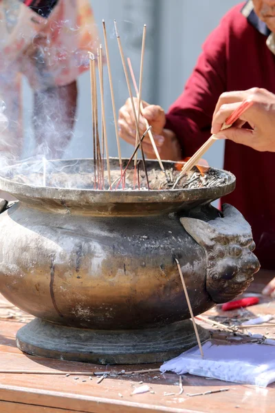 Prayers burning incense — Stock Photo, Image