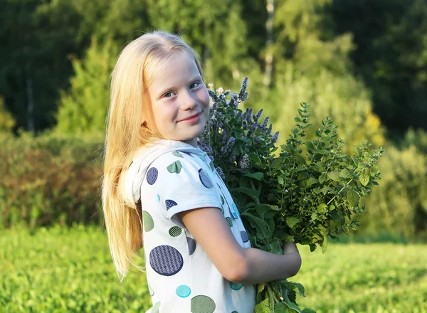 Little blonde girl with bouquet — Stock Photo, Image