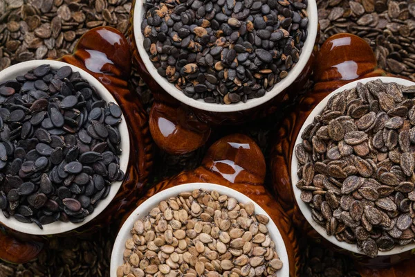 Watermelon, pumpkin and melon seeds on background.Different types of seeds,top view.Seeds background