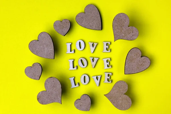 Hearts Word Love Made Wooden Letters Yellow Background Valentine Day — Stock Photo, Image