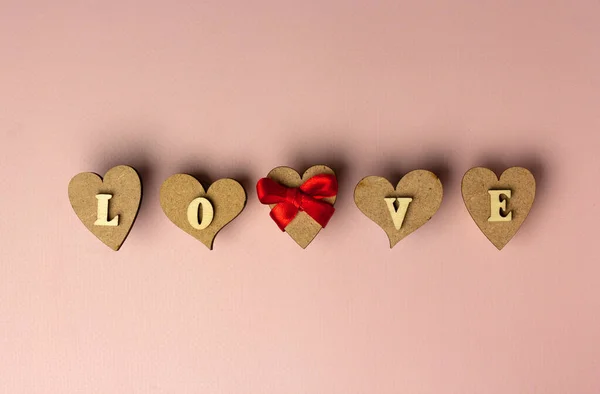 Hearts Word Love Made Wooden Letters Pink Background Valentine Day — Stock Photo, Image