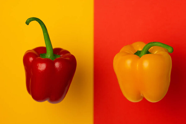 Red and yellow Bell peppers isolated on a bright background. Minimal healthy food concept. Detox menu set. Spicy meal veg fruit cook. Art design card. Copy space for text.