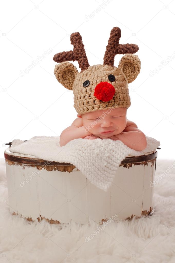 Smiling Baby Wearing a Red-Nosed Reindeer Hat