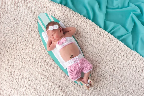 Newborn Baby Girl Sleeping on a Surfboard — Stock Photo, Image