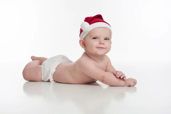Bebé feliz vestido con un sombrero de Santa — Foto de Stock