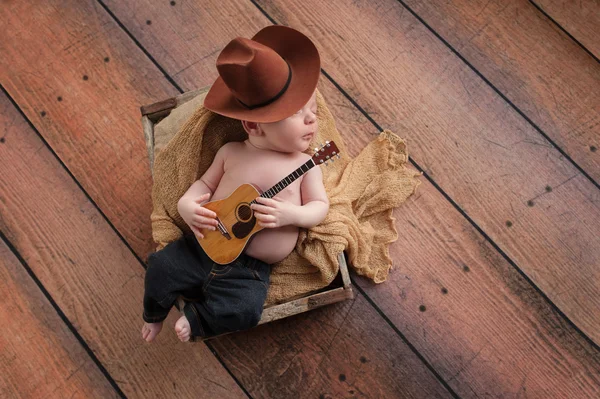 Newborn Baby Cowboy Playing a Tiny Guitar — Stock Photo, Image