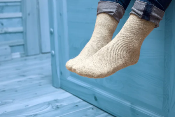 Female legs in woolen socks — Stock Photo, Image