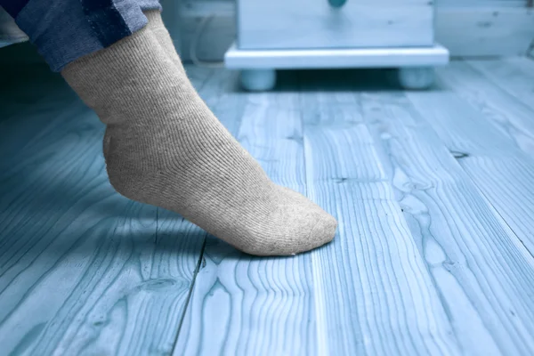 Female legs in woolen socks — Stock Photo, Image