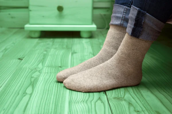 Female legs in woolen socks — Stock Photo, Image