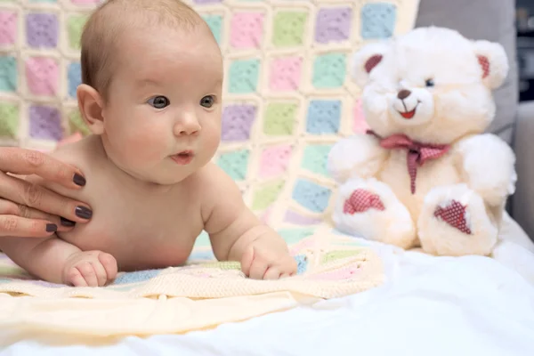 Happy baby lying on his stomach — Stock Photo, Image