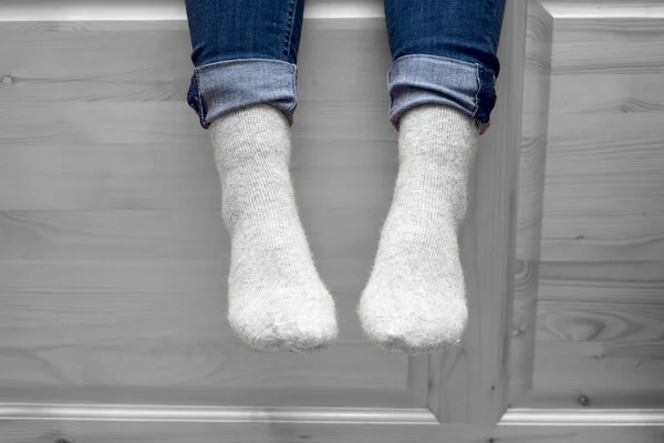 Female legs in woolen socks — Stock Photo, Image