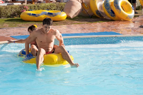 Couple rides in the water park — Stock Photo, Image