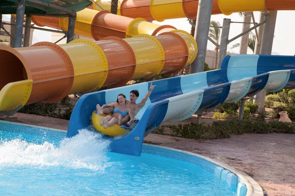 Couple rides in the water park — Stock Photo, Image