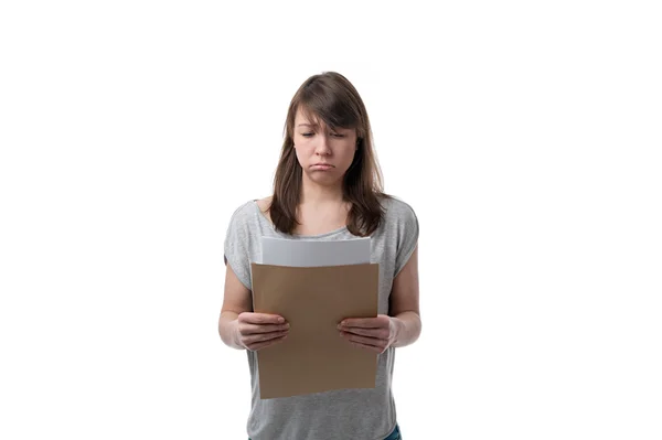 Sad woman reading a letter — Stock Photo, Image