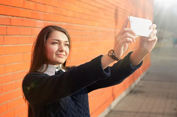 Young woman taking selfie with smartphone camera — Stock Photo, Image