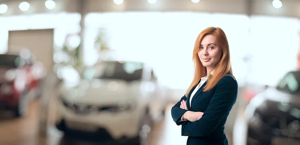 Beautiful car dealer consultant — Stock Photo, Image