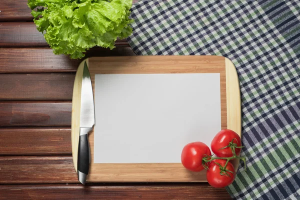 White sheet of paper on the kitchen table — Stock Photo, Image