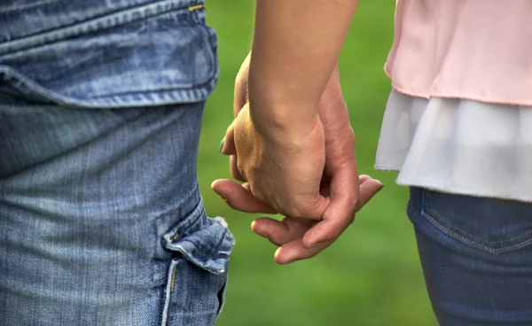A couple holding hands. Close-up of hands — Stock Photo, Image
