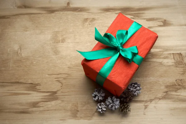 Red box with a gift inside — Stock Photo, Image