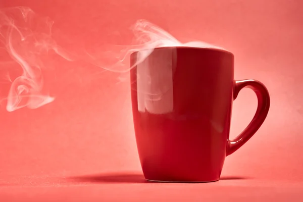 Cup of coffee on a red background — Stock Photo, Image