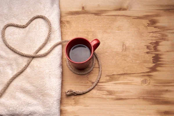 A cup of coffee on the wooden table — Stock Photo, Image