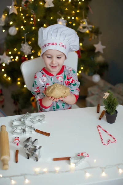 Cute Toddler Boy Making Christmas Cookies White Table Christmas Tree — Stock Photo, Image