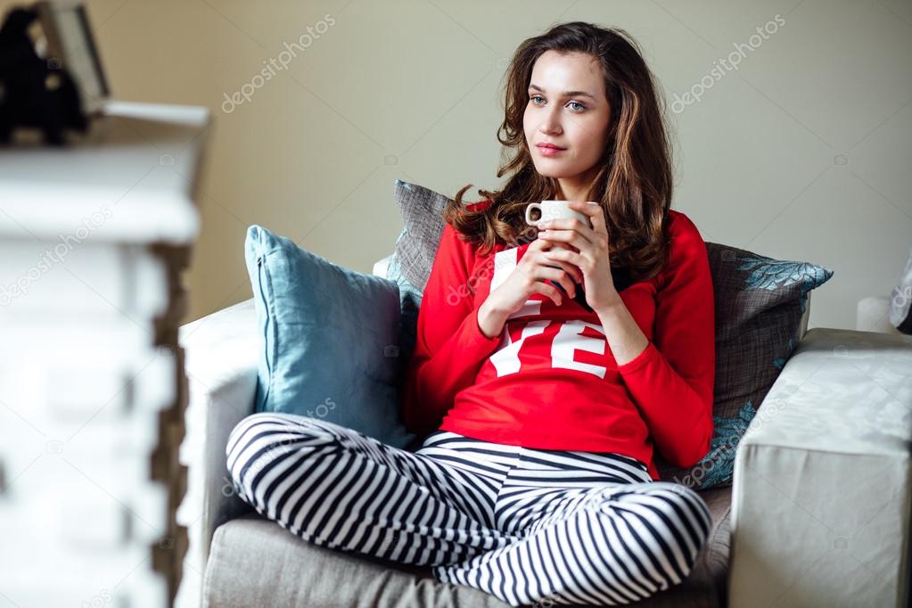 young woman relaxing in pyjamas 