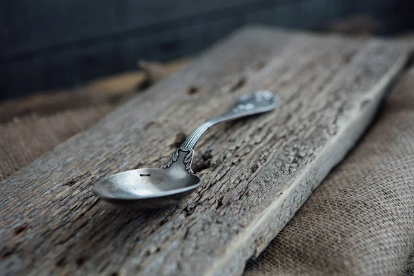 Old spoon on wood — Stock Photo, Image