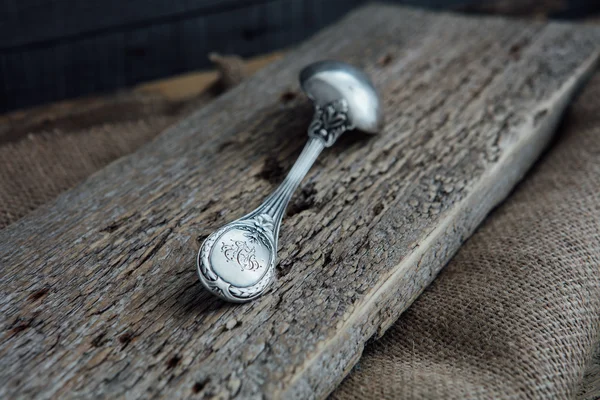 Old spoon on wood — Stock Photo, Image