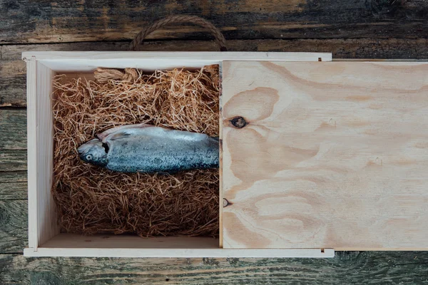 Fresh fish on wooden table — Stock Photo, Image