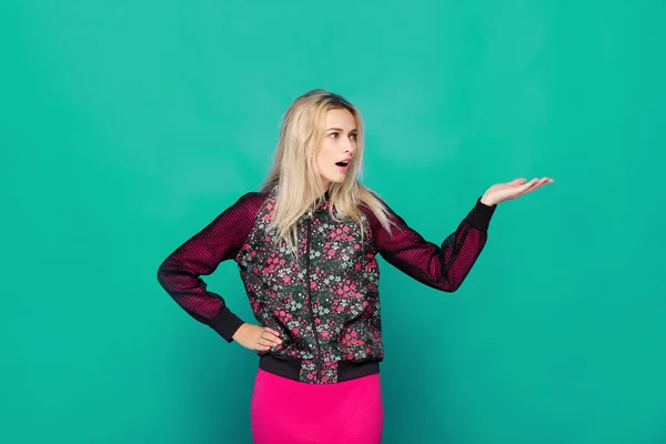 Blonde modern woman on blue background — Stock Photo, Image