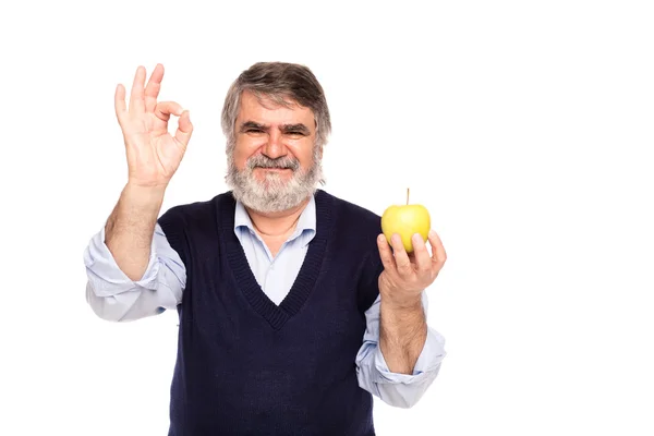 Vecchio con mela in mano — Foto Stock